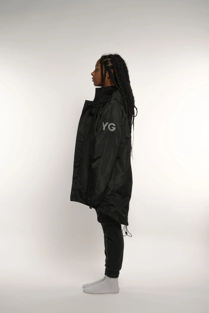 Abrigo impermeable negro con reflejante Young God Mexico